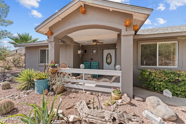 entrance to property featuring ceiling fan