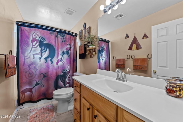 bathroom featuring vanity, toilet, tile patterned floors, and a shower with curtain