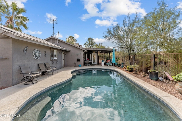 view of swimming pool featuring a patio