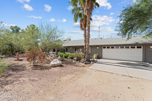 ranch-style home featuring a garage