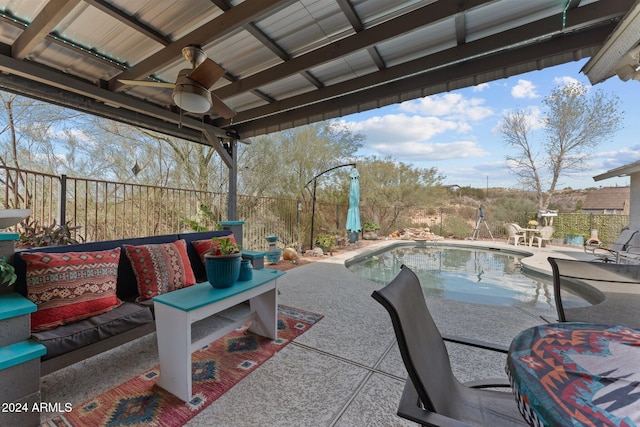 view of patio featuring ceiling fan and a fenced in pool