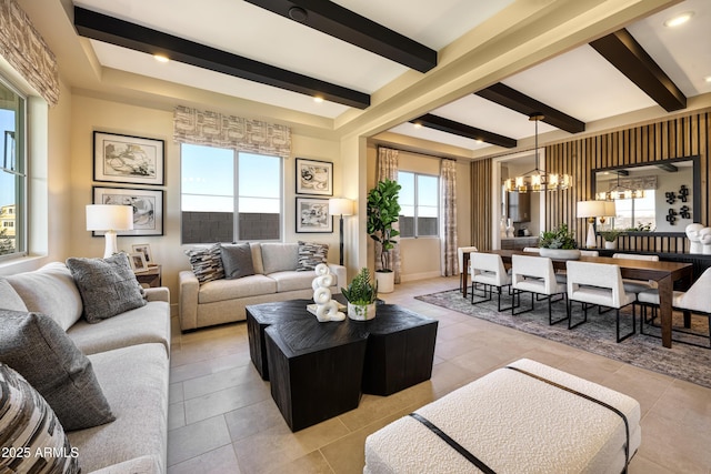 living room featuring a wealth of natural light, beam ceiling, light tile patterned flooring, and a notable chandelier