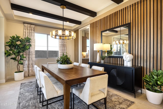 dining area with baseboards, beam ceiling, and an inviting chandelier