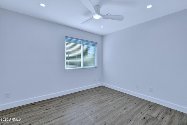 empty room featuring light hardwood / wood-style flooring and ceiling fan