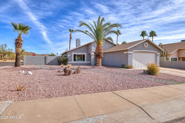 ranch-style house featuring a garage