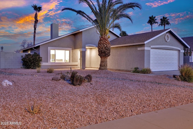 ranch-style home featuring a garage