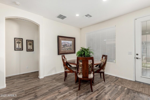 11312 E Newcastle Ave, Mesa, AZ 85209 - dining area featuring wood finished floors, arched walkways, and recessed lighting