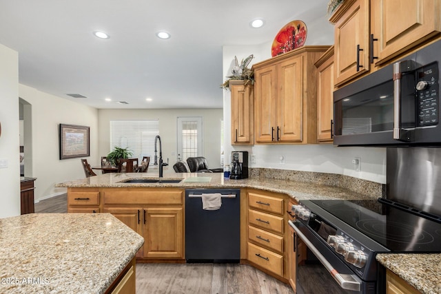11312 E Newcastle Ave, Mesa, AZ 85209 - kitchen with dishwashing machine, black microwave, a peninsula, light wood-style flooring, and recessed lighting