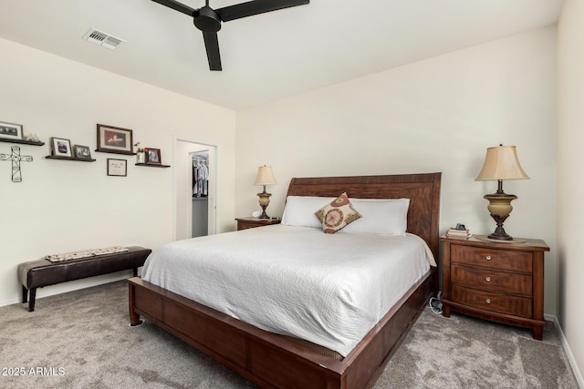 11312 E Newcastle Ave, Mesa, AZ 85209 - bedroom with carpet floors, a walk in closet, a ceiling fan, and a closet