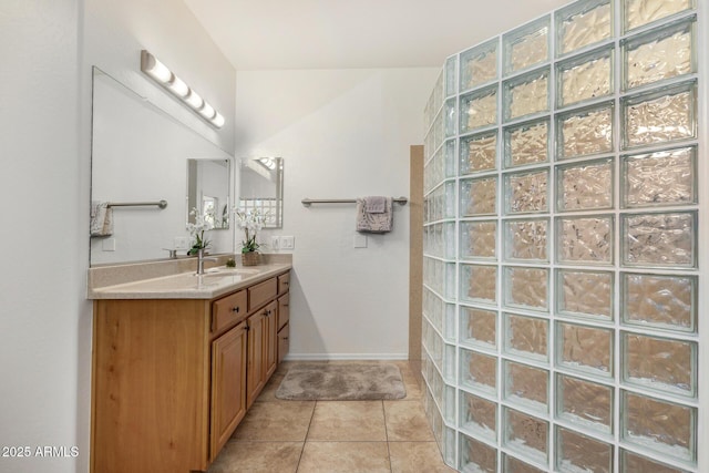 11312 E Newcastle Ave, Mesa, AZ 85209 - bathroom featuring a walk in shower, vanity, and tile patterned floors