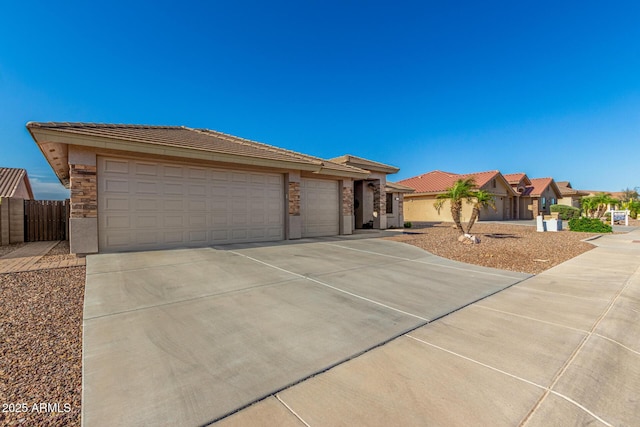 11312 E Newcastle Ave, Mesa, AZ 85209 - view of front of property featuring concrete driveway, a garage, and a tile roof