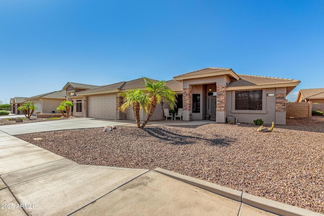 11312 E Newcastle Ave, Mesa, AZ 85209 - prairie-style home with an attached garage, driveway, stucco siding, and a tile roof