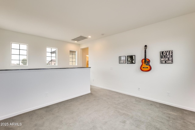 unfurnished room featuring carpet floors