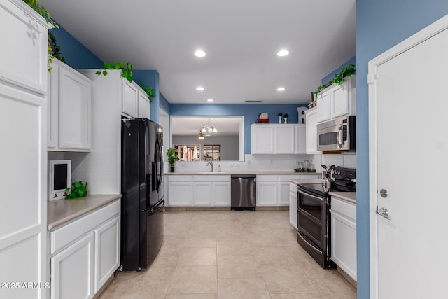 kitchen featuring light countertops, white cabinets, and appliances with stainless steel finishes