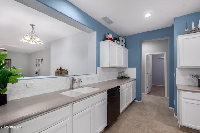 kitchen with visible vents, a notable chandelier, a sink, black dishwasher, and white cabinetry