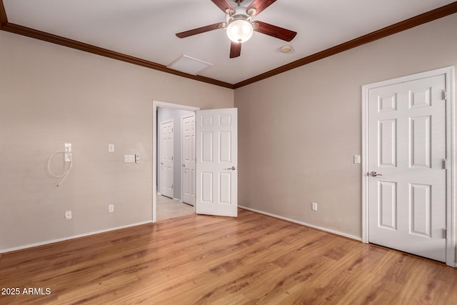 unfurnished bedroom featuring ceiling fan, light wood-type flooring, baseboards, and ornamental molding