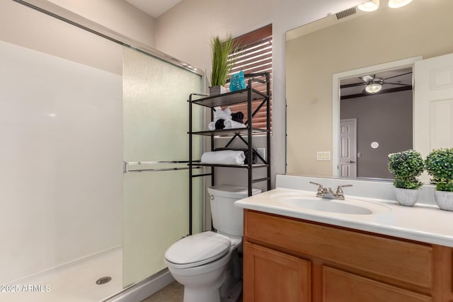 full bath with visible vents, a shower stall, toilet, and vanity