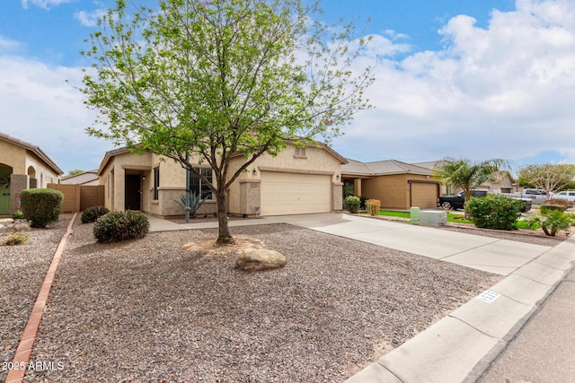 single story home with concrete driveway, a garage, and stucco siding