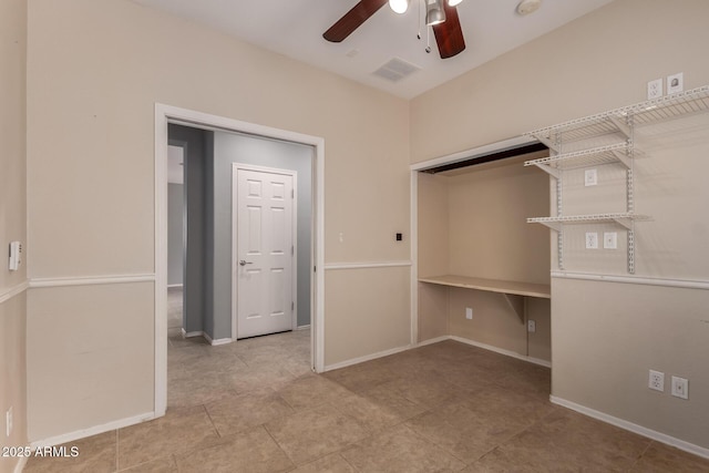 unfurnished bedroom featuring a ceiling fan, baseboards, and visible vents