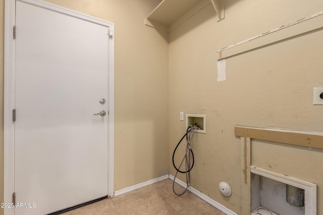 laundry area with light tile patterned floors, baseboards, washer hookup, and laundry area