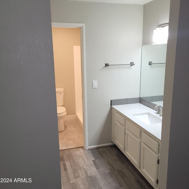 5236 W Peoria Ave Unit 135, Glendale, AZ 85302 - bathroom with toilet, wood finished floors, and vanity