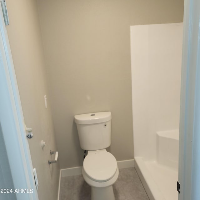 bathroom featuring tile patterned floors and toilet