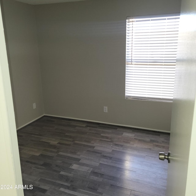 empty room featuring dark hardwood / wood-style floors