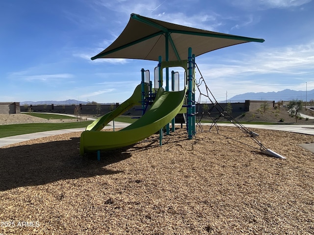 community jungle gym with a mountain view