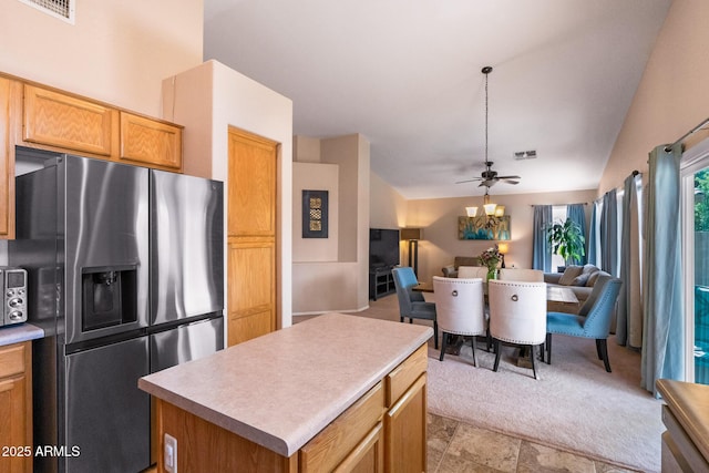 300 W Cardinal Way, Chandler, AZ 85286 - kitchen with stainless steel fridge with ice dispenser, open floor plan, a center island, light countertops, and vaulted ceiling