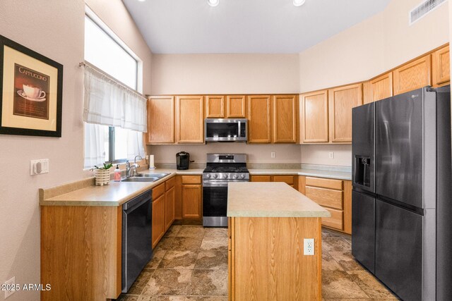300 W Cardinal Way, Chandler, AZ 85286 - kitchen featuring stainless steel appliances, a sink, light countertops, a kitchen island, and light stone finish flooring