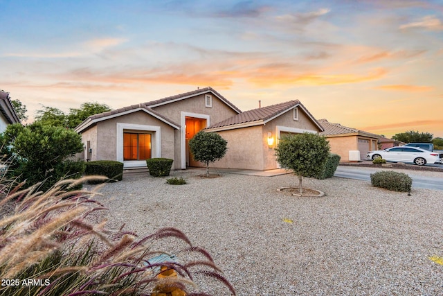 300 W Cardinal Way, Chandler, AZ 85286 - view of front of house with an attached garage, stucco siding, and a tiled roof