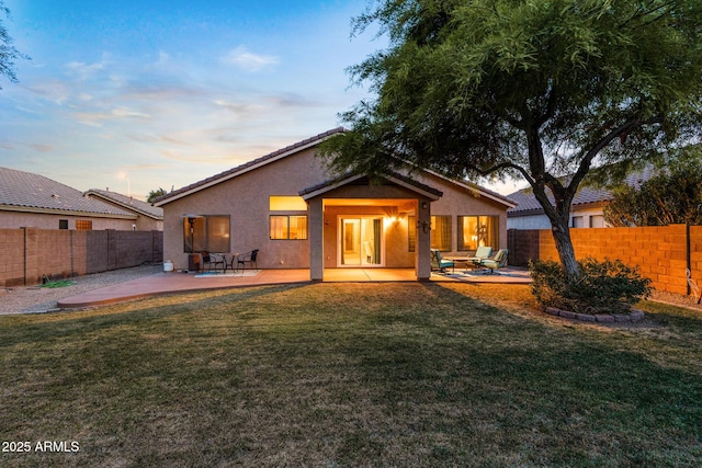 300 W Cardinal Way, Chandler, AZ 85286 - back of property at dusk with a patio and stucco siding