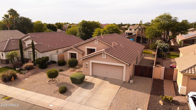 300 W Cardinal Way, Chandler, AZ 85286 - view of front of house with driveway, stucco siding, an attached garage, a tile roof, and a gate