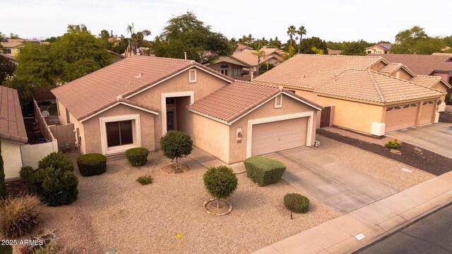 300 W Cardinal Way, Chandler, AZ 85286 - view of front of house featuring a garage, stucco siding, concrete driveway, and a tile roof