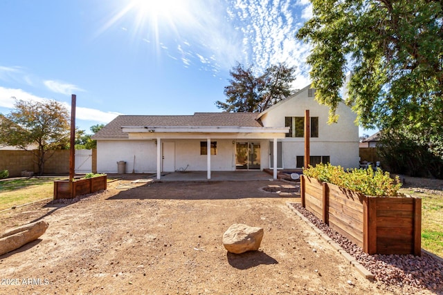 rear view of property featuring a patio