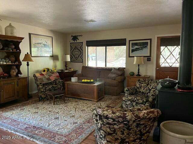 interior space featuring a wealth of natural light, visible vents, and a textured ceiling