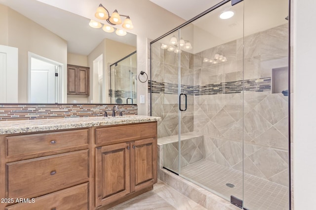 bathroom featuring walk in shower and vanity