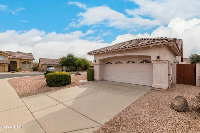 view of side of home featuring a garage