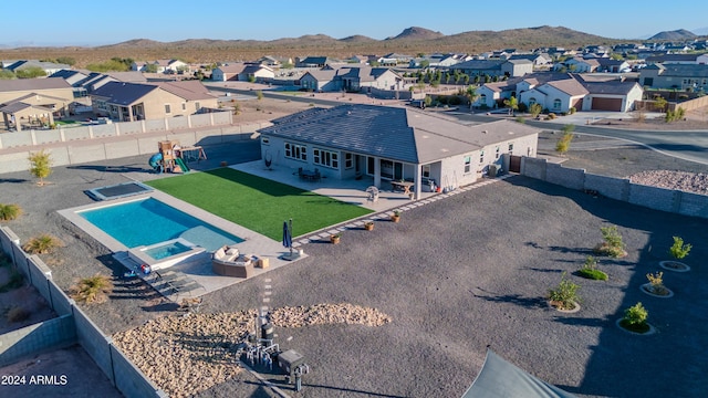 birds eye view of property featuring a mountain view