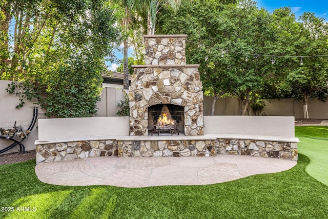 view of patio / terrace with an outdoor stone fireplace