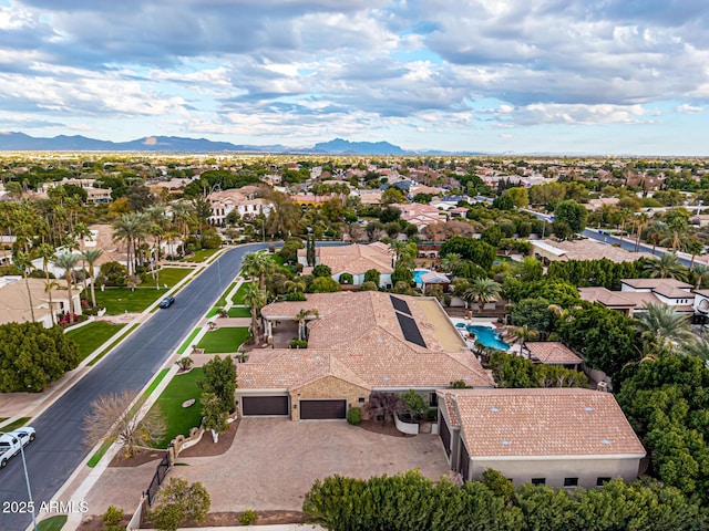 birds eye view of property featuring a mountain view