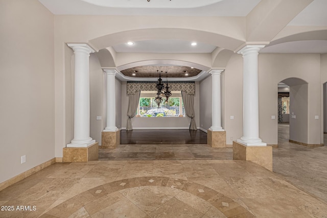 hallway featuring a chandelier