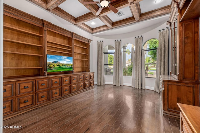 living room featuring dark hardwood / wood-style floors, ceiling fan, coffered ceiling, and beamed ceiling