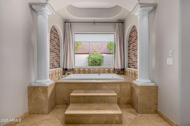 bathroom featuring a relaxing tiled tub