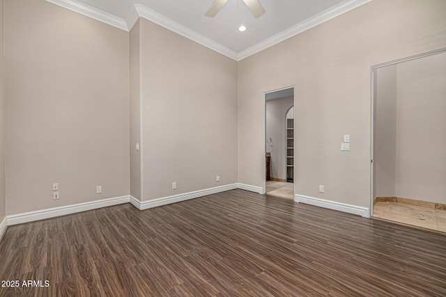 empty room featuring ceiling fan, dark hardwood / wood-style flooring, and ornamental molding