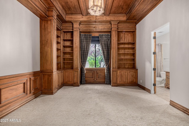 unfurnished room with light carpet, crown molding, and wooden ceiling