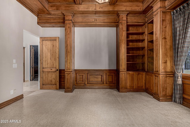 unfurnished living room featuring ornate columns and wood ceiling