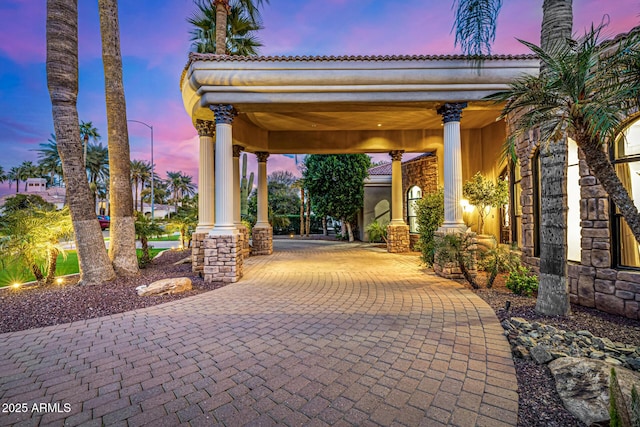 view of patio terrace at dusk