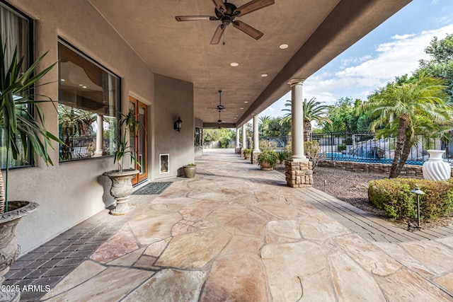 view of patio featuring ceiling fan