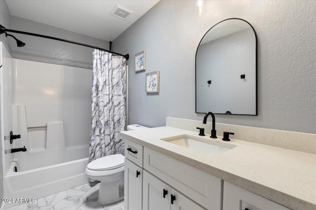 full bath featuring visible vents, a textured wall, toilet, vanity, and marble finish floor